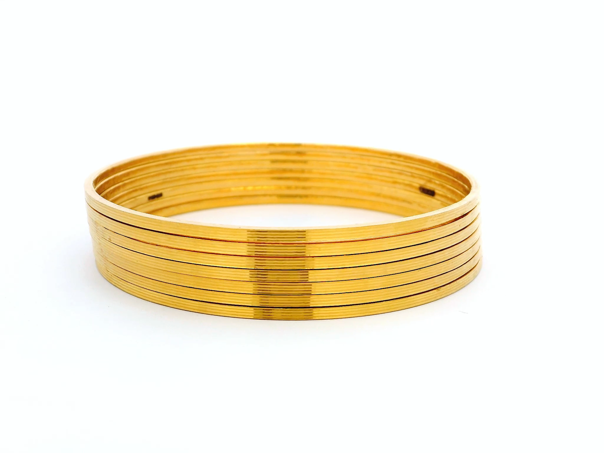 Set of Seven 22ct Gold Bangles with Horizontal Lines Design – Elegant and Contemporary Gold Bangle Set