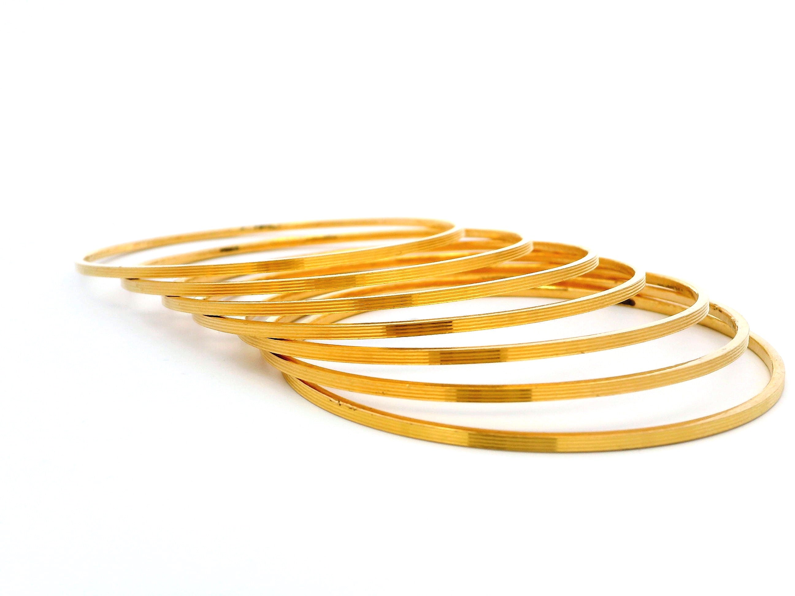 Set of Seven 22ct Gold Bangles with Horizontal Lines Design – Elegant and Contemporary Gold Bangle Set