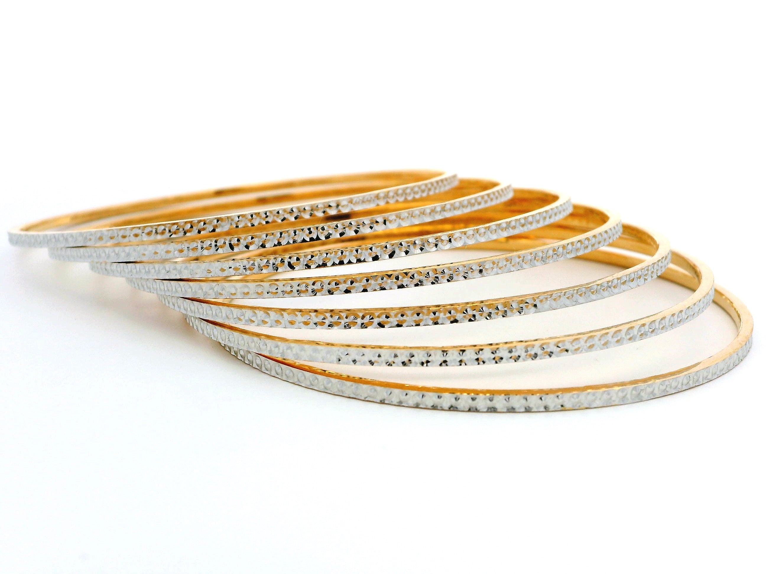 Set of Seven 22ct Gold Bangles with Milgrain Detailing & Rhodium Plating – Elegant Dual-Tone Design