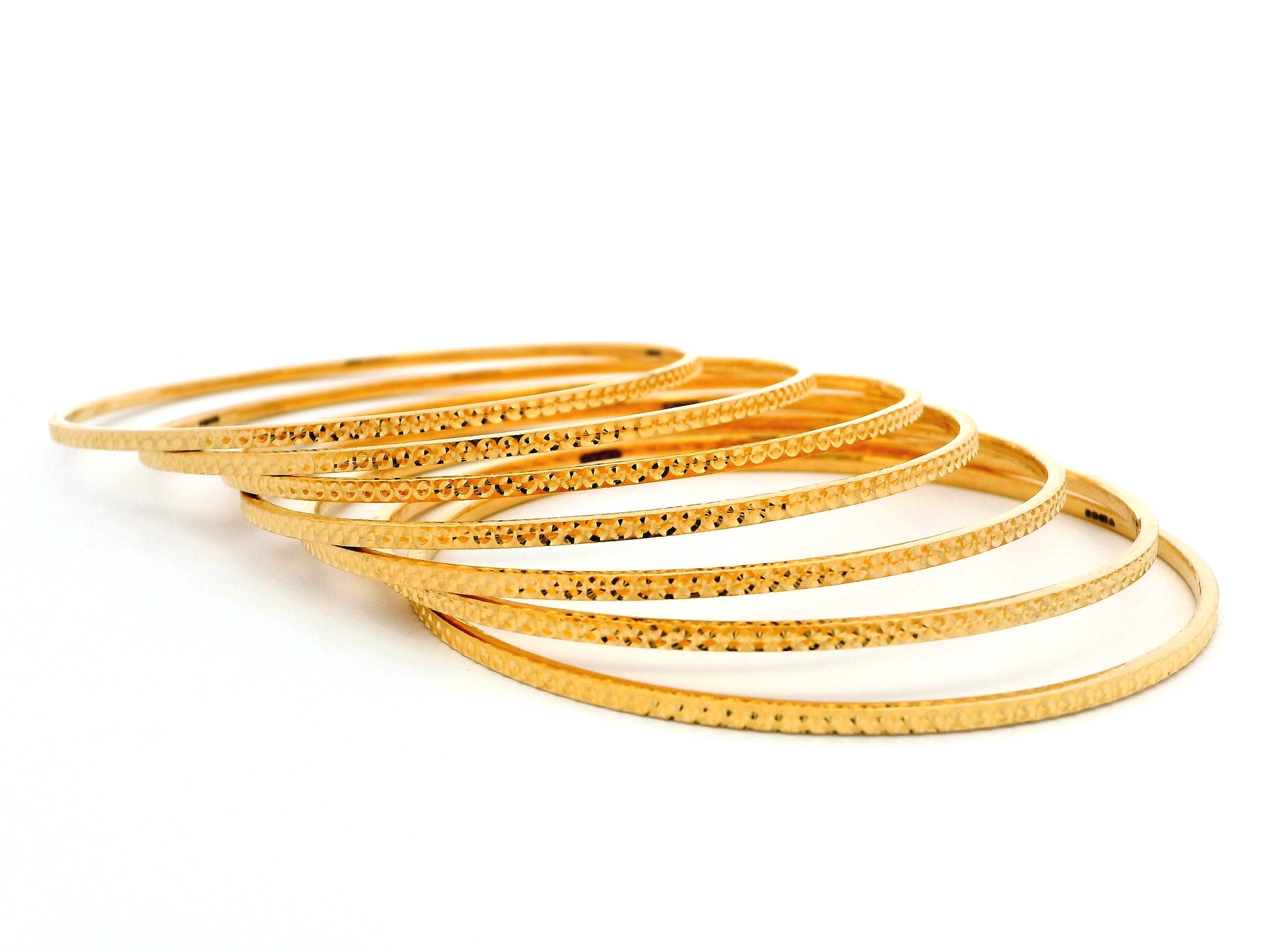 Set of Seven 22ct Gold Bangles with Exquisite Milgrain Design – Premium Gold Bangle Set